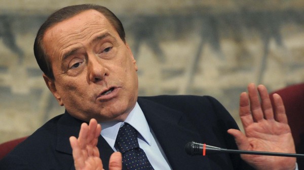 Italian PM Berlusconi gestures during a presentation of a book by Italian member of Parliament Scilipoti in Rome